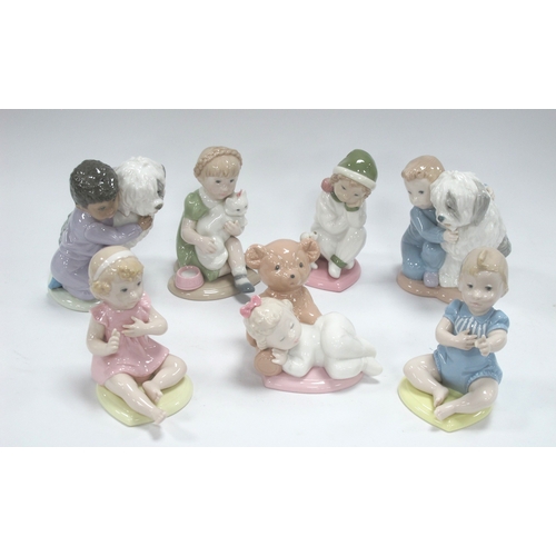 1270 - Golden Memories from Lladro figurines to include two children hugging dog, other seated toddlers tal... 