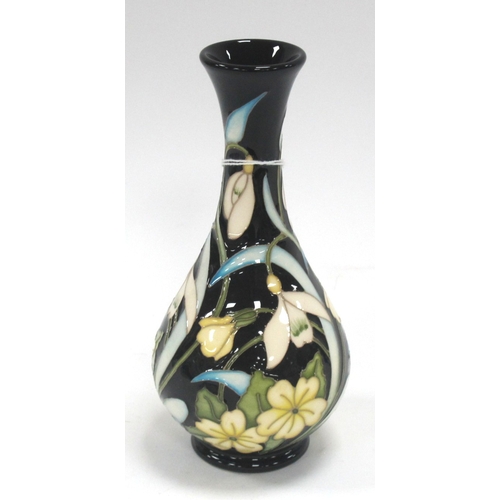 1255 - A Moorcroft Pottery Vase, decorated in the 'Primrose' design by Nicola Slaney, shape 80/6, number 94... 