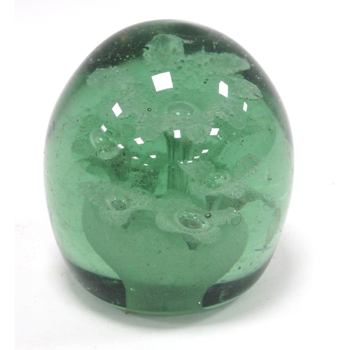 1211 - A Late XIX Century Green Glass Dump Paperweight, with flowerhead inclusions, 12cm high. Some surface... 