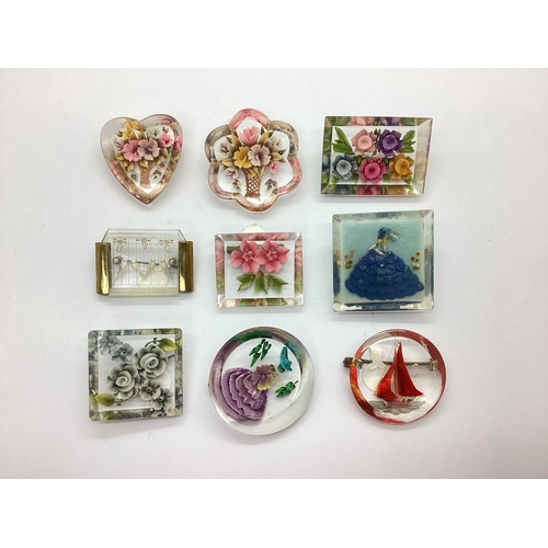 113 - A Collection of Early Plastic Style Brooches, featuring assorted reverse carved designs including cr... 