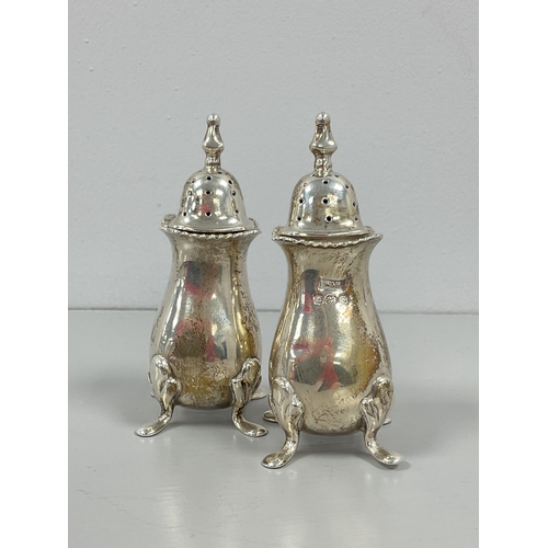 17A - A Pair of Hallmarked Silver Pepperettes, Walker & Hall, Birmingham 1942, each of plain baluster form... 