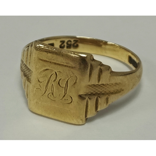 29 - A 9ct Gold Signet Ring, the rectangular panel initialled 