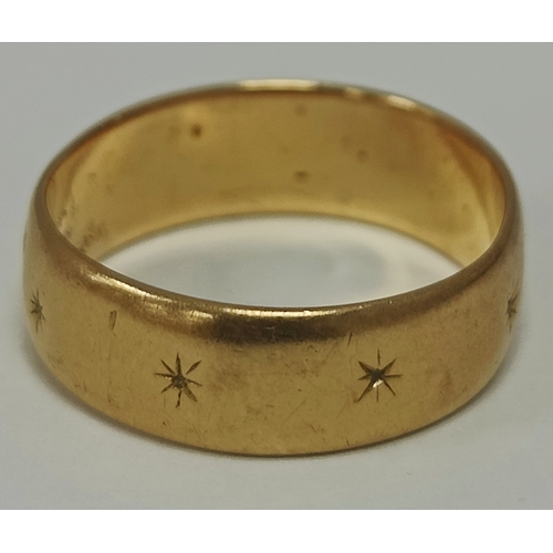 32 - A Wedding Band Style Ring, engraved starburst decoration throughout (misshapen) (finger size approx.... 