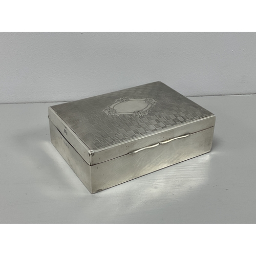 6 - A Hallmarked Silver Cigarette Box, J.G Ltd, Birmingham 1925, the hinged lid of engine turned design,... 