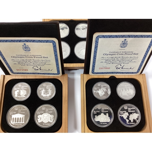 457 - Three Canada Olympics Four Coin Silver Proof Sets, both cased with certificates of authenticity.