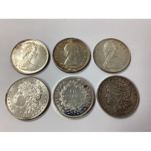 492 - Collection Of Six Silver Coins, including two USA 'Morgan' Dollars, three Canada 1 Dollars and a 197... 