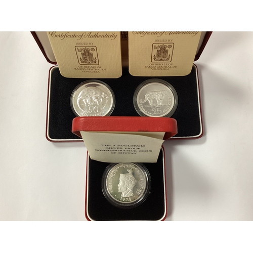 556 - Three Royal Mint Silver Proof Coins, including a Venezuela two coin 50 and 25 Bolivares set and a 19... 