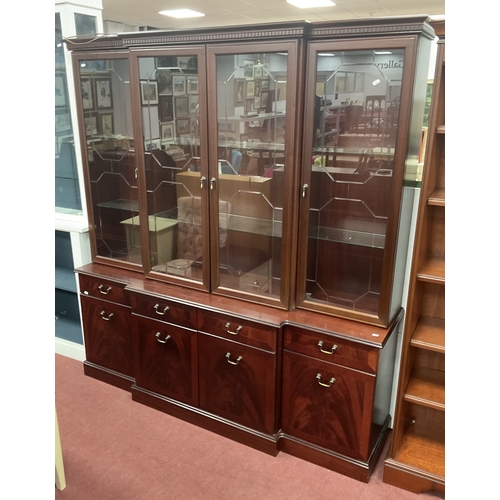 1483 - A Breakfront Display Cabinet, base with four cupboards and drawers, top with four glass fronted door... 