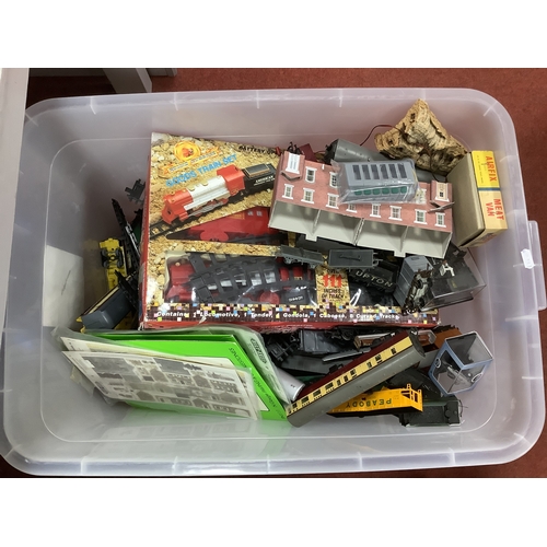 774 - A large quantity (in four tubs) of model railway workshop items including building kits, scenery, wa... 