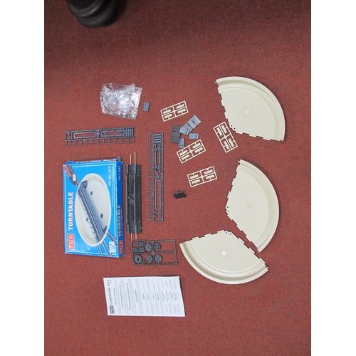 779 - A boxed Peco 00 gauge turntable kit together with a motorising kit, untested.