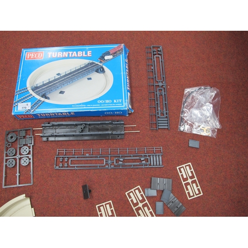 779 - A boxed Peco 00 gauge turntable kit together with a motorising kit, untested.