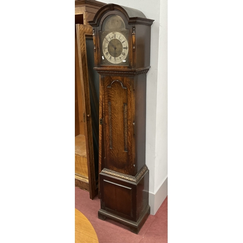 1572 - A 1940's Oak Grandfather Clock, arched hood with split balusters, trunk with applied panel, base on ... 