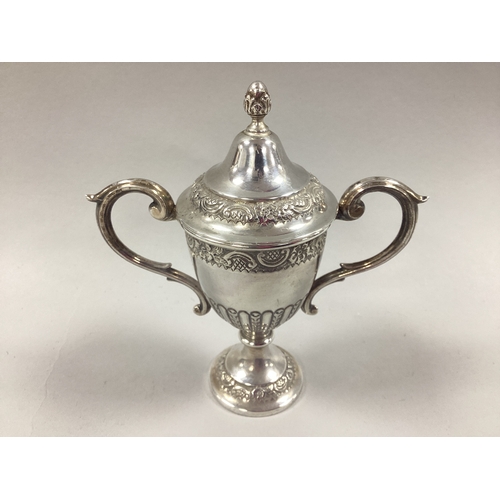 10 - A Decorative Miniature Hallmarked Silver Twin Handled Lidded Trophy Cup, RP, London 1922, approximat... 