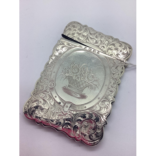 149 - A Decorative Victorian Hallmarked Silver Card Case, H&T(? rubbed), Birmingham 1860, of shaped rectan... 