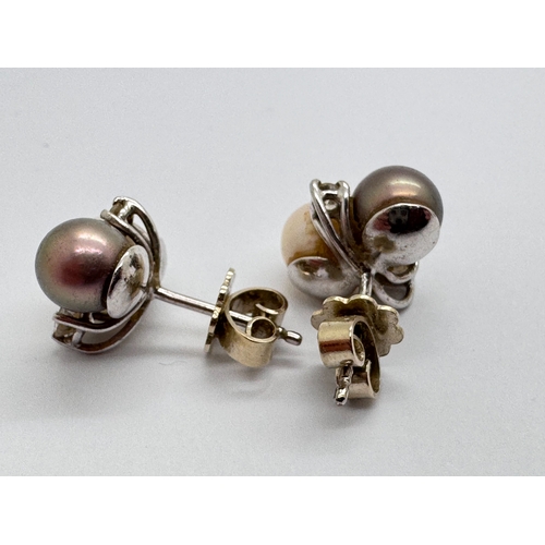 159 - A Pair of Freshwater Pearl and Diamond Set Earrings, the asymetrical claw set diamonds between peaco... 