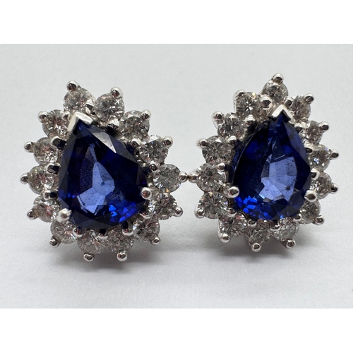 161 - A Pair of 18ct White Gold Large Sapphire and Diamond Cluster Earrings, of teardrop shape, the centre... 