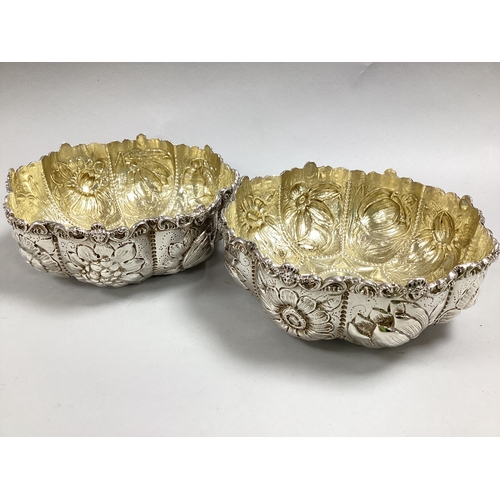 17 - A Pair of Highly Decorative Victorian Hallmarked Silver Dishes, William Comyns, London 1884, each of... 