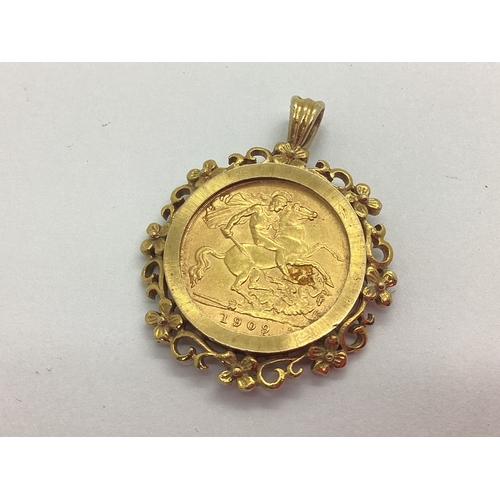 187 - 1909 Edward VII Gold Half Sovereign, set within a 9ct gold pendant mount, of scrolling foliage desig... 