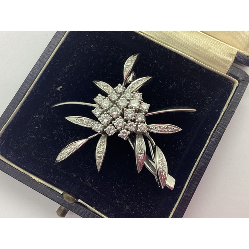 208 - A Highly Decorative 18ct White Gold Diamond Set Abstract Floral Brooch, the brilliant cut diamonds c... 