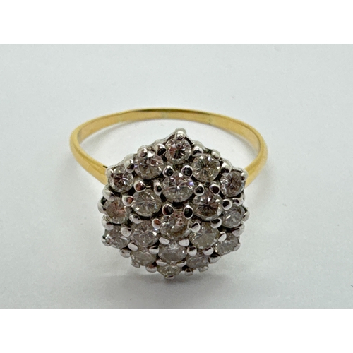 252 - A Large Diamond Cluster Ring, of hexagonal form, claw set throughout with brilliant cut stones (fing... 