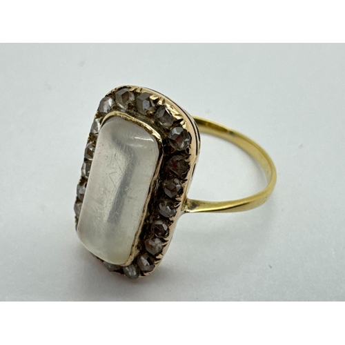 257 - An Antique Moonstone and Diamond Rectangular Cluster Ring, the cabochon moonstone collet set to the ... 