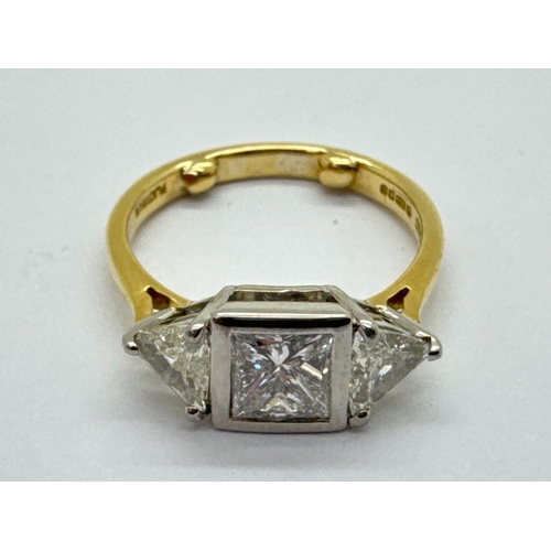 261 - A Modern 18ct Gold Princess and Trillion Cut Three Stone Diamond Ring, collet rubover set to the cen... 