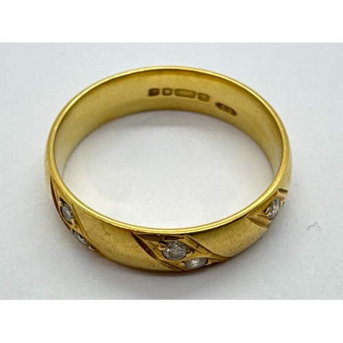 266 - An 18ct Gold Diamond Inset Band, the collet set diamonds within geometrical style surround, to plain... 