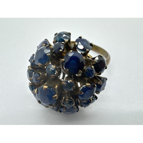 267 - A 1960's Style Sapphire High Cluster Ring, claw set throughout with graduated stones, stamped 