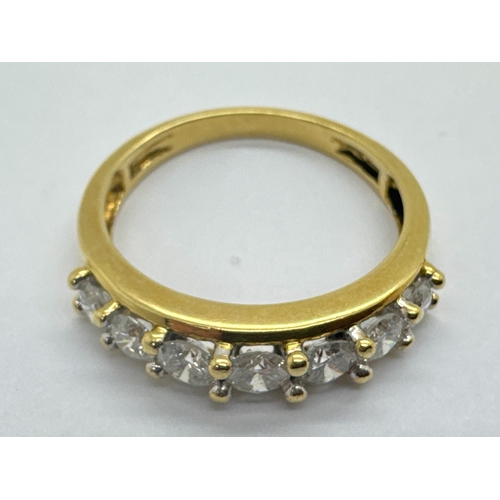 268 - A Modern 18ct Gold Seven Stone Diamond Ring, claw set with brilliant cut stones, between plain shoul... 