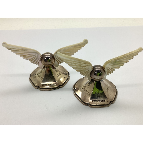 28 - A Pair of Hallmarked Silver and Mother of Pearl Knife Rests, JD&S, Sheffield 1905, each of carved wi... 