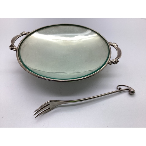 30 - Georg Jensen; A Shallow Twin Handled Footed Dish, with plain glass liner, between stylised handles, ... 