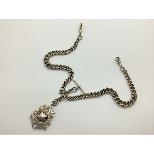 357 - A Graduated Curb Link Double Albert Chain, to double swivel style clasps, suspending T-bar and doubl... 