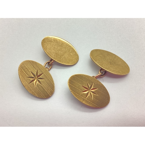 361 - A Pair of 9ct Gold Cufflinks, the oval panels on chain connections, with star detail.