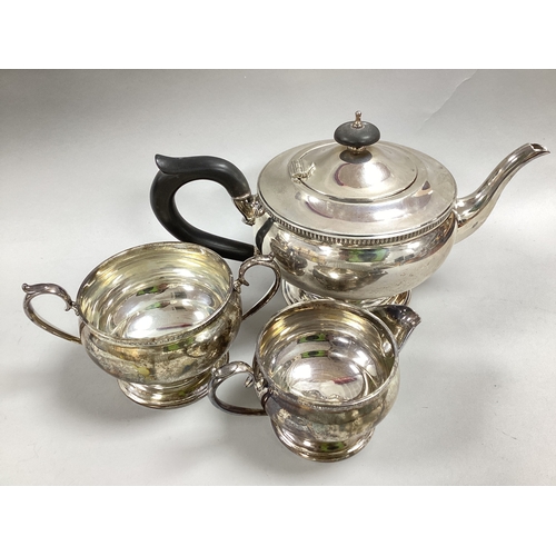 37 - A Hallmarked Silver Three Piece Teaset, WB, Sheffield 1943, comprising teapot, twin handled sugar bo... 