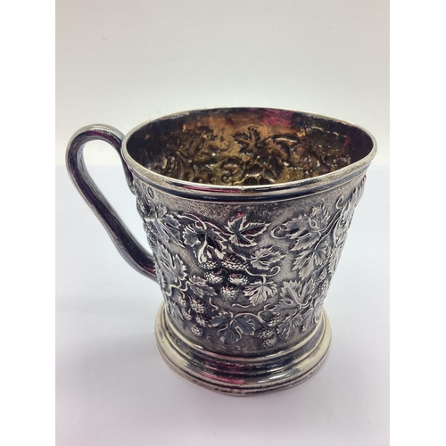 45 - A Victorian Hallmarked Silver Decorative Repousse Christening Mug, ISH, London 1874, (misshapen), wi... 