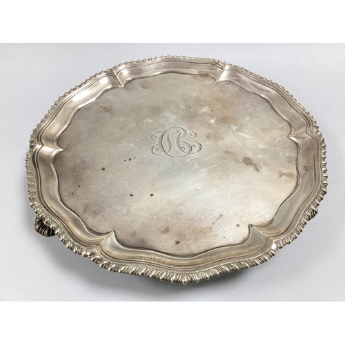 49 - A Georgian Hallmarked Silver Salver, E.C, London 1768, of circular form with decorative wavy rim in ... 