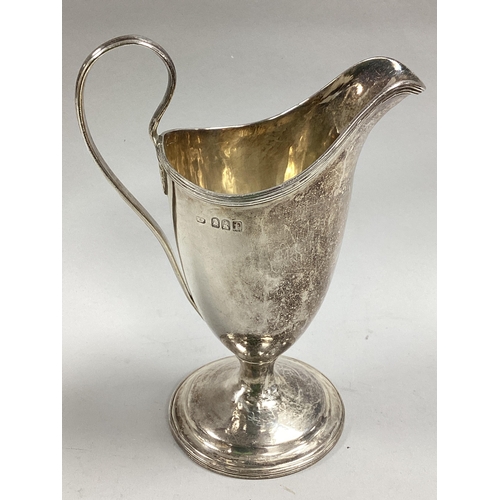 54 - A Britannia Standard Hallmarked Silver Helmet Shape Jug, (makers mark rubbed) London 1914, of plain ... 