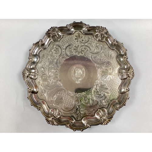 56 - A Silver Plated Reid Family Crest Salver, of shaped circular form with scrolling shell design in rel... 