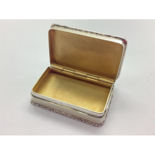 58 - Asprey London; A Hallmarked Silver Snuff Box, Birmingham 1961, of rectangular form with allover engi... 