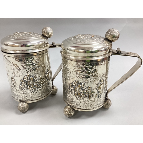 7 - A Pair of Danish Plated Lidded Tankards, each of cylindrical form allover detailed in relief with ou... 