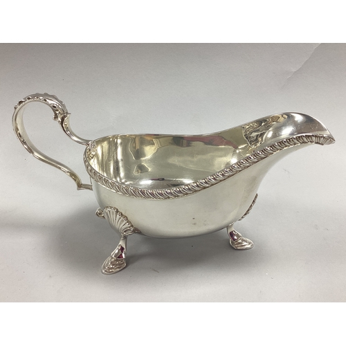 70 - William Hutton & Sons; A Hallmarked Silver Sauce Boat, Birmingham 1938, with decorative textured rim... 