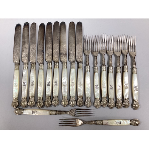 8 - A Set of Nine Mother of Pearl Handled Dessert / Fruit Knives and Forks, of highly decorative vine de... 