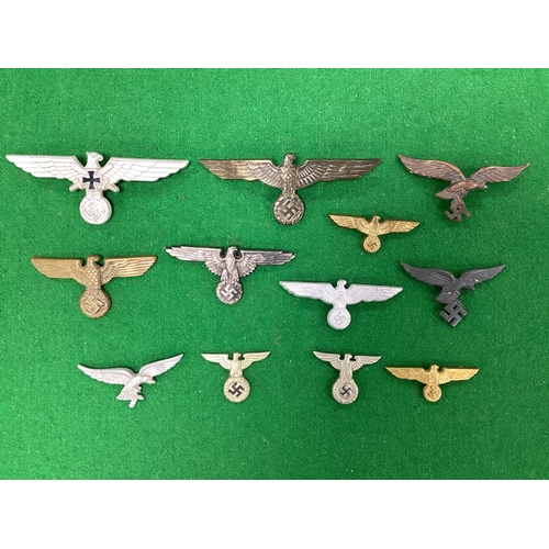 WWII Third Reich Wehrmacht and SS Eagle Cap and Tunic Insignia.