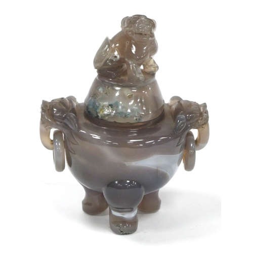 1129 - A Chinese Carved Agate Koro and Cover, with Dog of Fo finial, the cylindrical body with drop ring ha... 