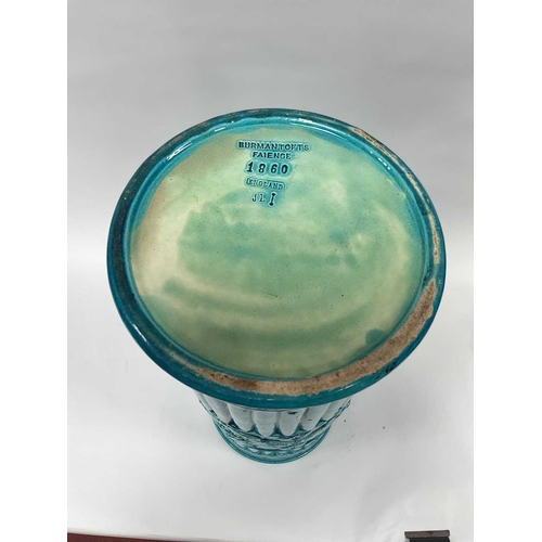 1123 - A Burmantofts Pottery Faience Stick Stand, decorated in a turquoise glaze, the cylindrical body moul... 
