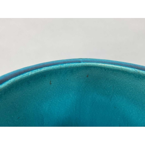 1123 - A Burmantofts Pottery Faience Stick Stand, decorated in a turquoise glaze, the cylindrical body moul... 