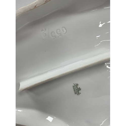 1046 - A Rosenthal Porcelain Figure Group, modelled as two embracing putti, upon a shaped oval base, printe... 