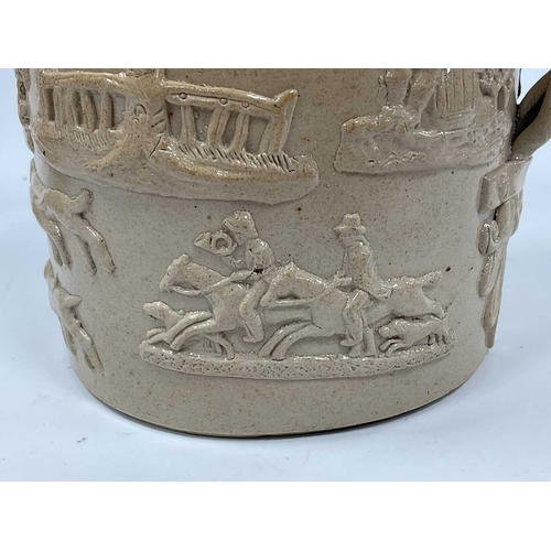 1044 - A Brampton Stoneware Large Tankard, the shaped brown ground applied with a hunting scene, trees and ... 