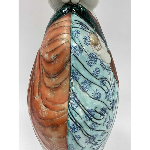 1133 - A Mid XX Century Chinese Pottery Lamp, modelled as a double sided boy in colourful robes with floral... 