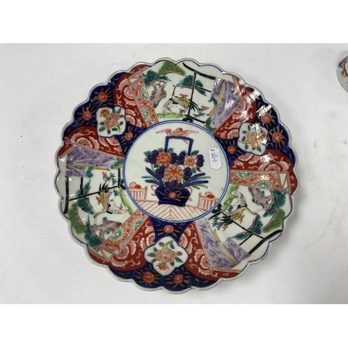1140 - A Late XIX Century Japanese Imari Ware Plate, of shaped circular form, painted in panels with flower... 
